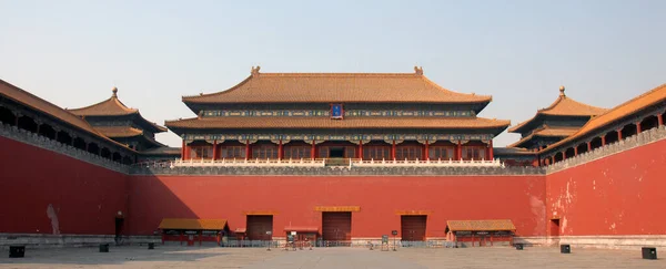 Forbidden City, Beijing, China. The entrance to the Forbidden City has a sign saying \'Meridian Gate\'. Entrance signs are Chinese with English translations. The Forbidden City has Chinese architecture. UNESCO site in China.