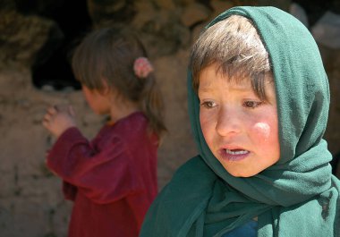 Bamyan (Bamiyan) in Central Afghanistan. These poor girls live in the caves in Bamyan (Bamiyan), Afghanistan. Cave dwellers in the cliffs near to the Bamyan (Bamiyan) Buddhas, Afghanistan clipart