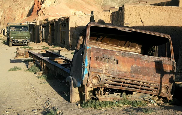 A rusting old truck is abandoned by the roadside in Yakawlang in Central Afghanistan. It was probably a Kamaz truck which are widespread in Afghanistan. The Kamaz lettering has long since been lost.