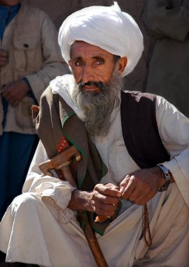 A small town between Chaghcharan and the Minaret of Jam in Ghor Province, Afghanistan. An old Afghan man with a long grey beard and white turban in Central Afghanistan near Chaghcharan. clipart