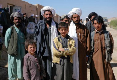 A small town between Chaghcharan and the Minaret of Jam in Ghor Province, Afghanistan. Local Afghan men and boys in a village in a remote part of Central Afghanistan near Chaghcharan. clipart