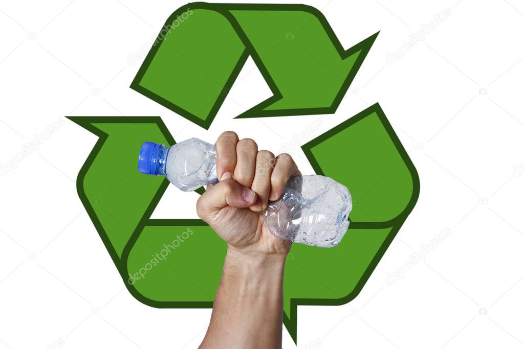 Hand squeezing Plastic Bottle representing movement against pollution and for recycling. Recycling logo in the background.