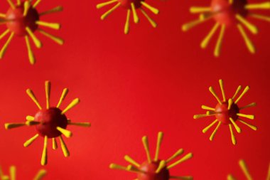 Kırmızı arkaplanda virüs modelleri