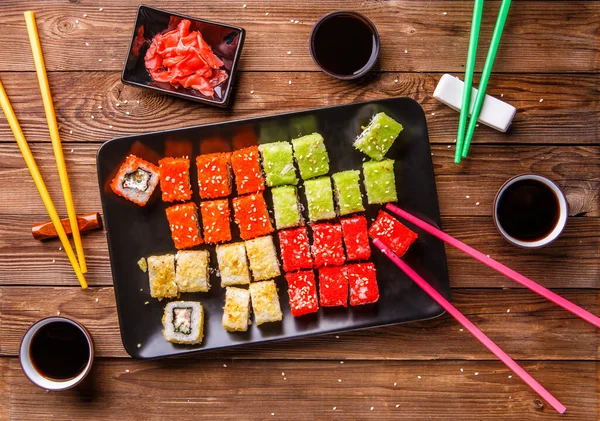 Sushi Set Rolls Soy Sauce Served Black Plate Wooden Background — ストック写真