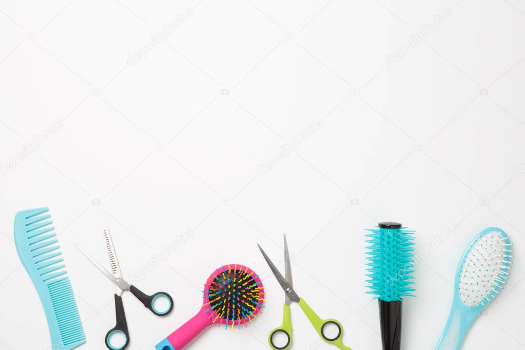 Image of combs and scissors isolated on white background. Place for text