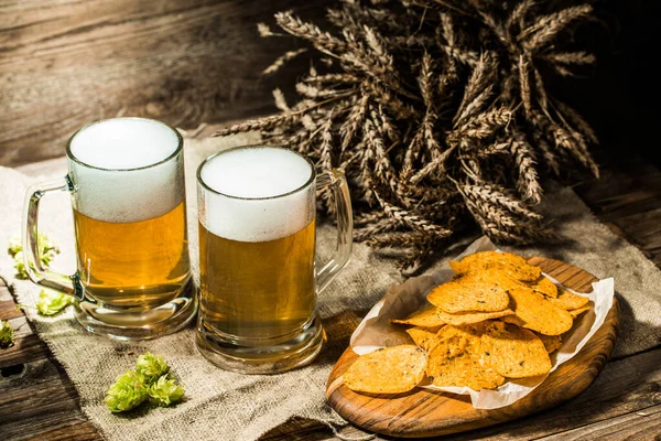 Two Beer Mugs Hops Chips Wheat Linen Cloth Table — Stock Photo, Image