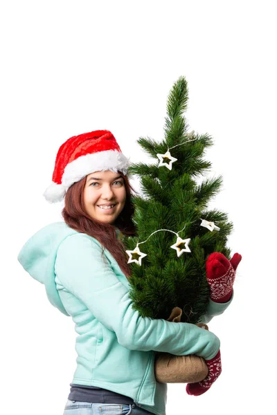 Photo Woman Santa Cap Christmas Tree Hand Empty White Background — Stock Photo, Image