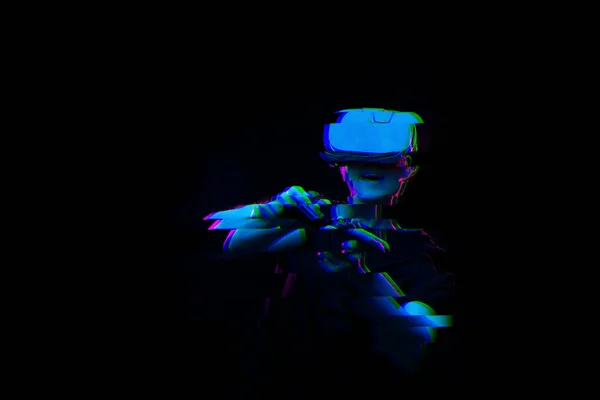 Man with virtual reality headset is playing game. Image with glitch effect. — Stock Photo, Image