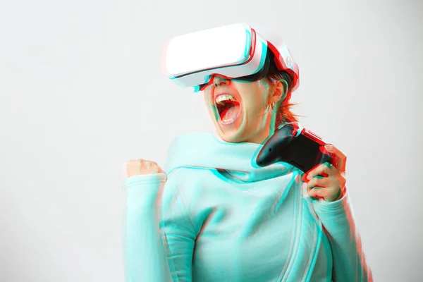 Woman with virtual reality headset is playing game. Image with glitch effect. — Stock Photo, Image