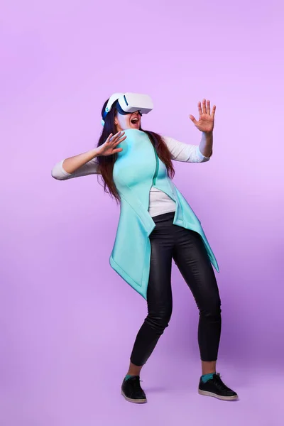 Woman wearing virtual reality headset.