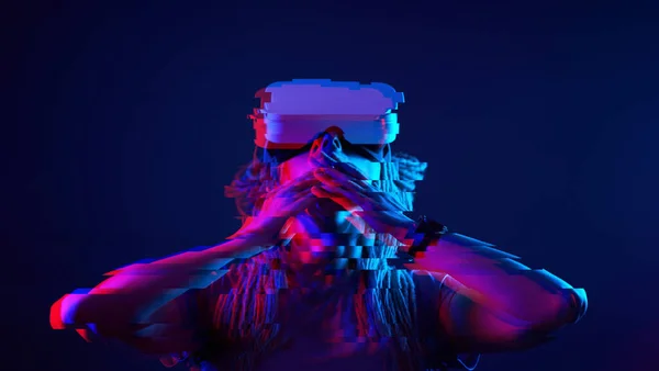 Woman is using virtual reality headset. Neon light studio portrait. Image with glitch effect. — Φωτογραφία Αρχείου