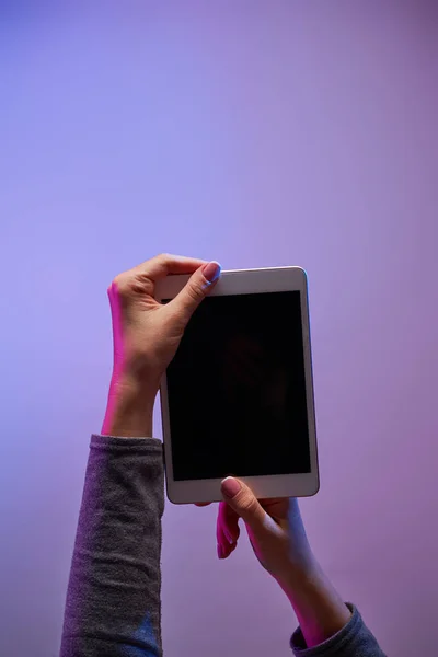 Humans hands with smartphone and blank black screen