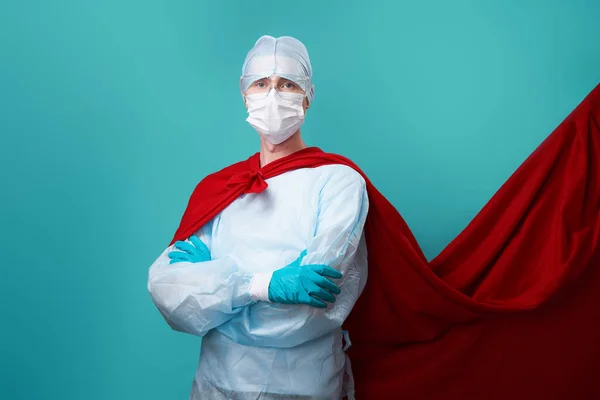 Doctor wearing surgical face mask in superhero cape. — Stock Photo, Image