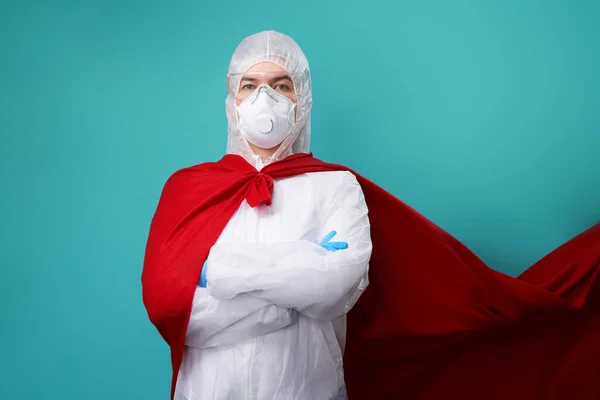 Doctor is wearing PPE - costume, gloves and surgical face mask in superhero cape. — Stock Photo, Image