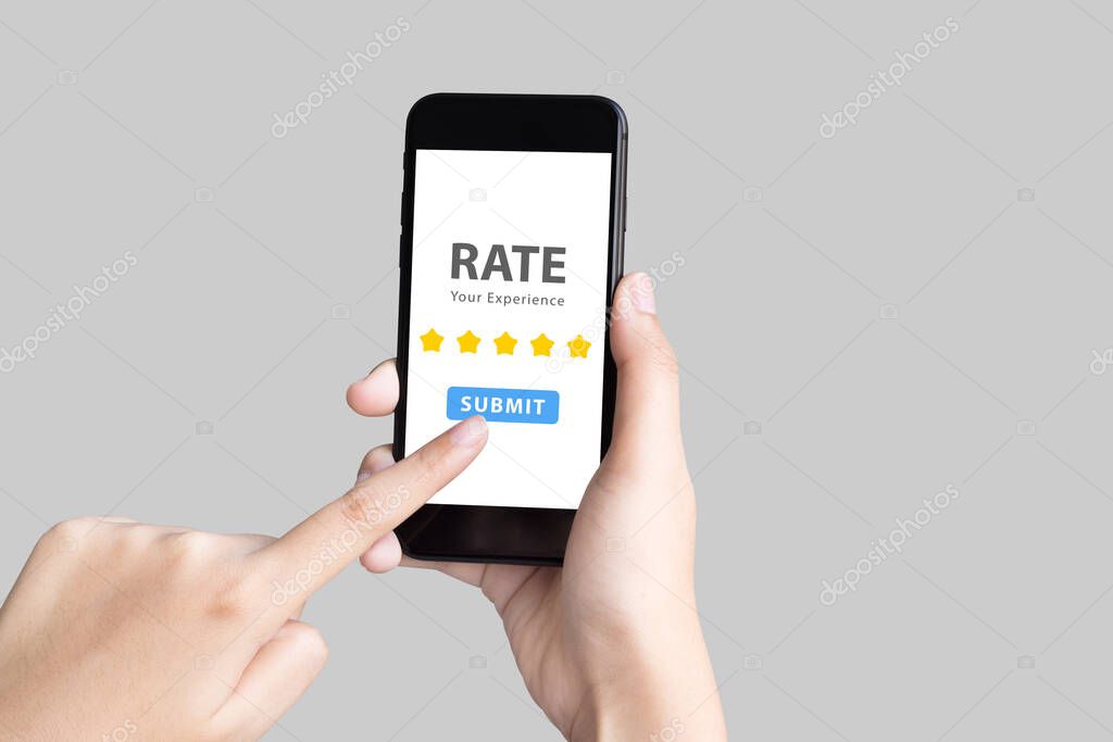 Hand holding phone and give 5 star rate experience on grey background with clipping path