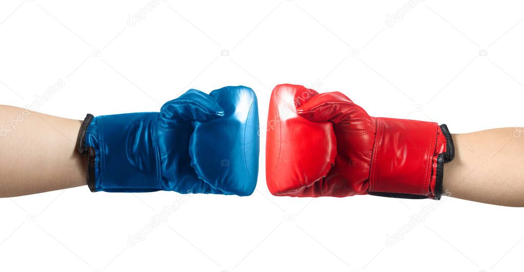 Isolated photo of male hands in red and blue boxing gloves punching on white background.