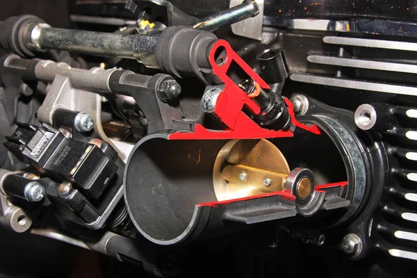Cut away view of air control valve in vehcle fuel injection system.