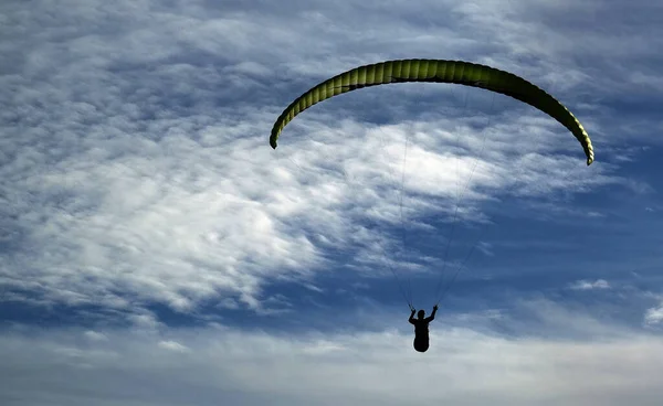 Para gliding over cliffs on the east coast of Yorkshire. UK.