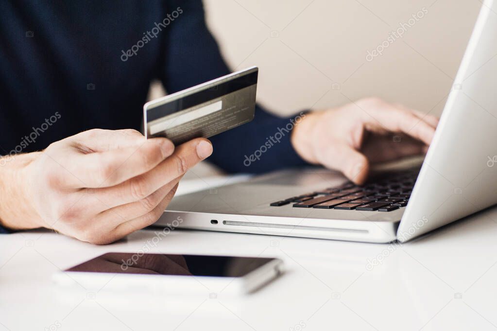 Young man shopping online 