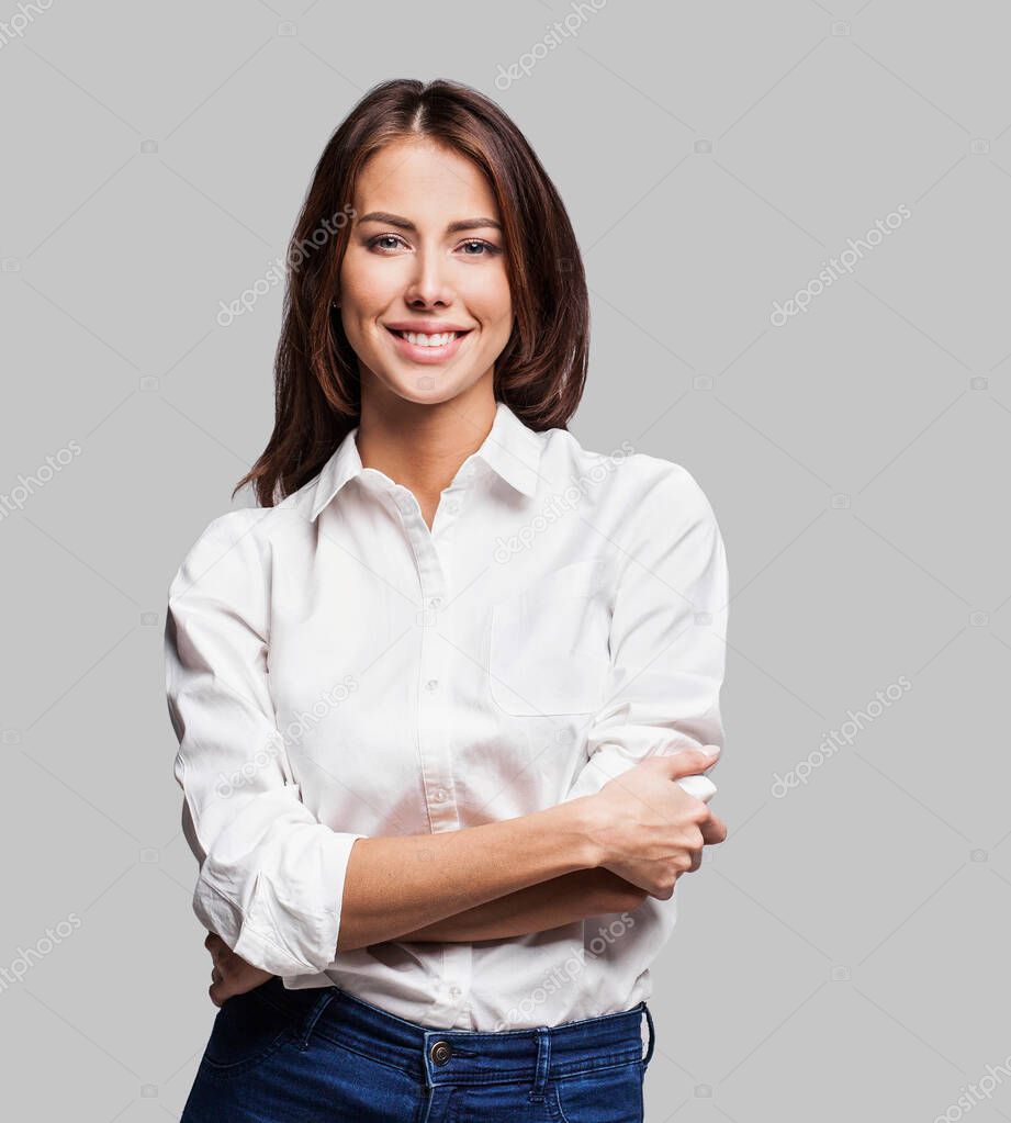 Young beautiful business woman posing in studio