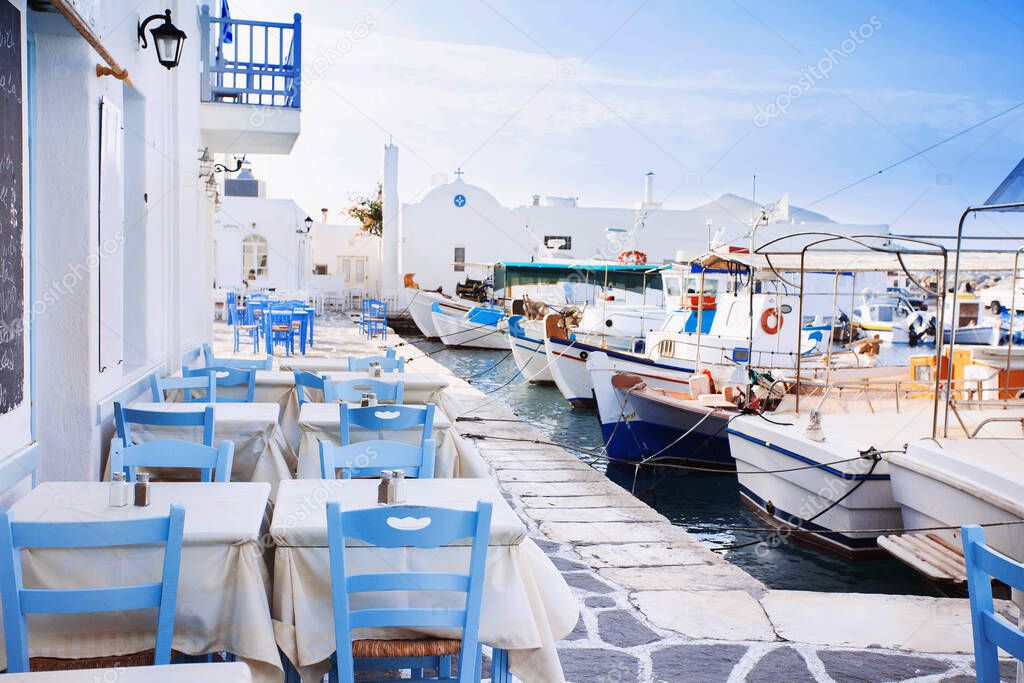Greek fishing village in Paros, Naousa, Greece. Outdoor restaurant