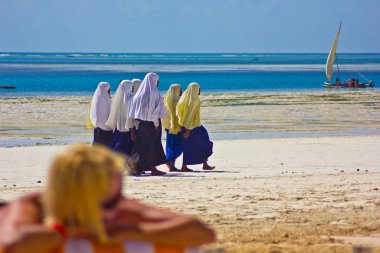school girls on the beach in zanzibar