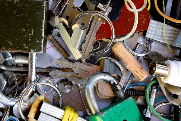 Utiliti room mess of things in storage, mixture of keys,pins,screws,rings,clamps and other home, or office, drawers. Old home mess.