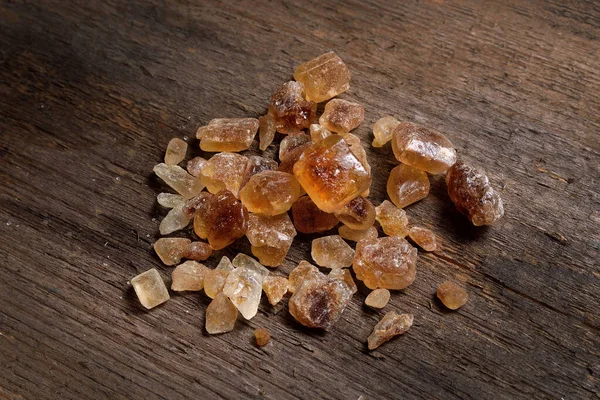 Brown Amber Sugar Crystals Spilled Old Wooden Board — Stock Photo, Image