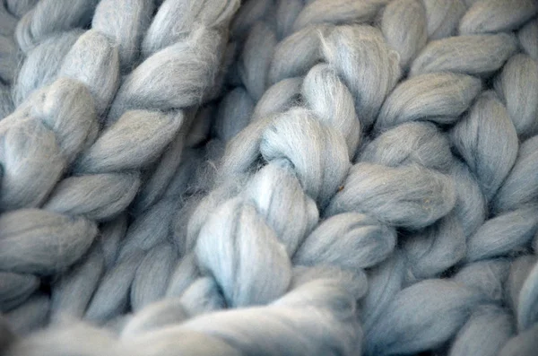 Hand Dyed Merino Wool. Close-up of knitted blanket, merino wool background