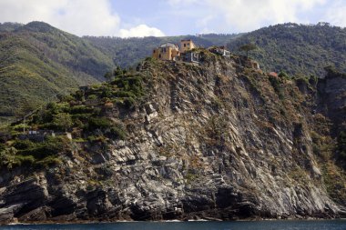 Cinque Terre ( SP ), Italy - April 15, 2017: Houses on the cliffs view from a boat, gulf of Poets, Cinque Terre, La Spezia, Liguria, Italy
