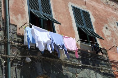 Vernazza ( SP ), Italy - April 15, 2017: Clothes drying on clothesline in Vernazza village, gulf of Poets, Cinque Terre, La Spezia, Liguria, Italy