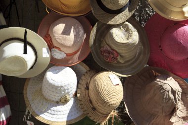Riomaggiore ( SP ), Italy - April 15, 2017: Hats near a souvenir shop in Riomaggiore village, gulf of Poets, Cinque Terre, La Spezia, Liguria, Italy