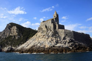 Portovenere ( SP ), Italy - April 15, 2017: San Pietro Church view from the sea, Portovenere, gulf of Poets, Cinque Terre, La Spezia, Liguria, Italy