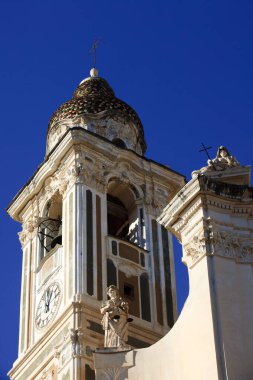 Laigueglia (SV), Italy - February 15, 2017: The bell tower and the church in Laigueglia village, Riviera dei Fiori, Savona, Liguria, Italy.