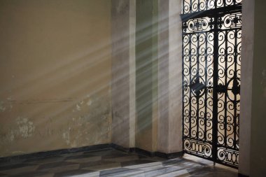 Laigueglia (SV), Italy - February 15, 2017: A door with a grate in Laigueglia church, Riviera dei Fiori, Savona, Liguria, Italy.