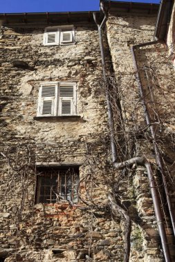 Triora (IM), Italy - February 15, 2017: Old houses details in The witches village of Triora, Imperia, Liguria, Italy. 