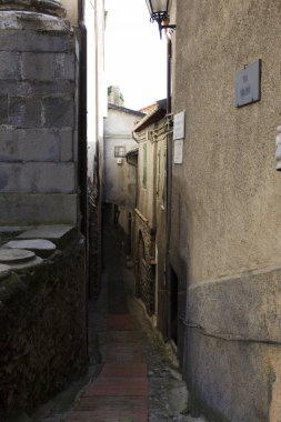 Triora (IM), Italy - February 15, 2017: A small path through the houses in the witches village of Triora, Imperia, Liguria, Italy. 