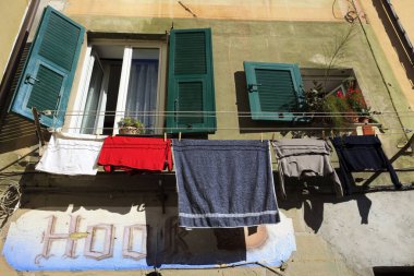 Camogli (GE), Italy - June 01, 2017: Clothes drying on clothesline in the fishing village of Camogli, Gulf of Paradise, Portofino National Park, Genova, Liguria, Italy
