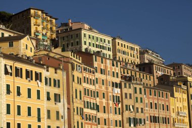 Camogli (GE), Italy - June 01, 2017: Colourful houses in the fishing village of Camogli, Gulf of Paradise, Portofino National Park, Genova, Liguria, Italy