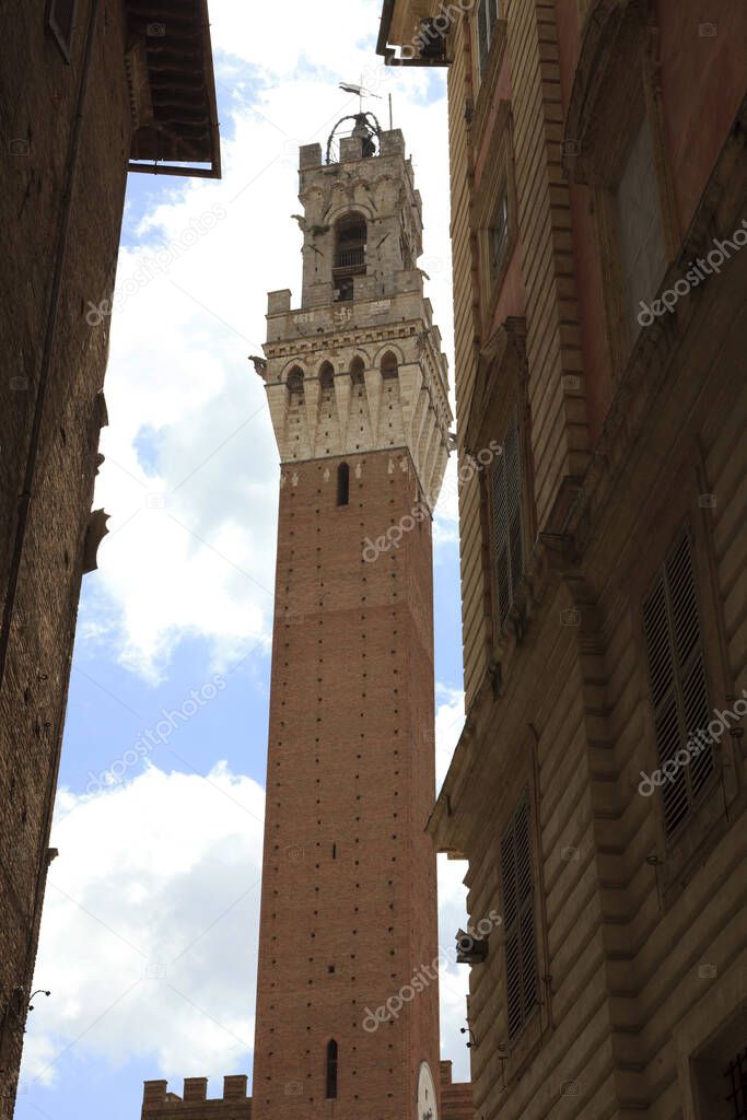 Siena (SI), Italy - June 01, 2016: Mangia tower in the old town of Siena, Tuscany, Italy