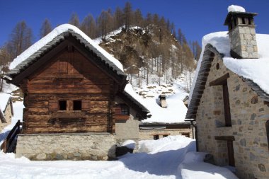 Devero Park ( Verbano-Cusio-Ossola ), Italy - January 15, 2017: Crampiolo village and houses in Alpe Devero Park, Ossola Valley, VCO, Piedmont, Italy