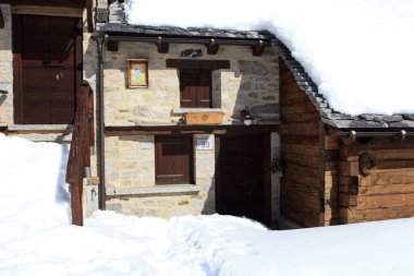 Devero Park ( Verbano-Cusio-Ossola ), Italy - January 15, 2017: Crampiolo village and houses in Alpe Devero Park, Ossola Valley, VCO, Piedmont, Italy