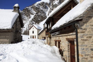 Devero Park ( Verbano-Cusio-Ossola ), Italy - January 15, 2017: Crampiolo village and houses in Alpe Devero Park, Ossola Valley, VCO, Piedmont, Italy