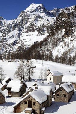 Devero Park ( Verbano-Cusio-Ossola ), Italy - January 15, 2017: Crampiolo village and houses in Alpe Devero Park, Ossola Valley, VCO, Piedmont, Italy