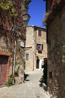 Montemerano (GR), Italy - September 11, 2017: A typical road and houses in Montemerano village, Manciano, Grosseto, Tuscany, Italy, Europe