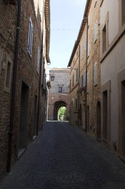 Monteleone d' Orvieto (TR), Italy - May 27, 2016: A road and houses in Monteleone d' Orvieto village, Orvieto, Terni, Umbria, Italy