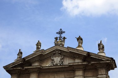 Mantova (MN), Italy - June 10, 2017: Baroque style Carrara marble facade and Gothic bell tower, Cathedral of Saint Peter the Apostle, Piazza Sordello, Mantova, Lombardy, Italy