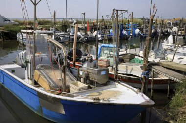 Mesola (FE),  Italy - April 30, 2017: Fish boats on Po river near Mesola, Delta Regional Park, Emilia Romagna, Italy