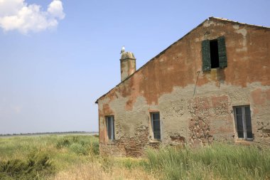 Po river (FE),  Italy - April 30, 2017: An old Fisherman's house detail on Po river, Delta Regional Park, Emilia Romagna, Italy