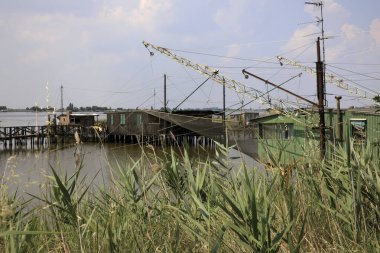 Po river (FE),  Italy - April 30, 2017: An old Fisherman's house on Po river, Delta Regional Park, Emilia Romagna, Italy